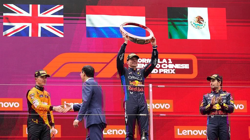 (AP Photo)
 : Winner Red Bull driver Max Verstappen of the Netherlands, center, celebrates on the podium with second placed McLaren driver Lando Norris of Britain, left, and third Red Bull driver Sergio Perez of Mexico after the Chinese Formula One Grand Prix at the Shanghai International Circuit, Shanghai, China, Sunday, April 21, 2024. 

